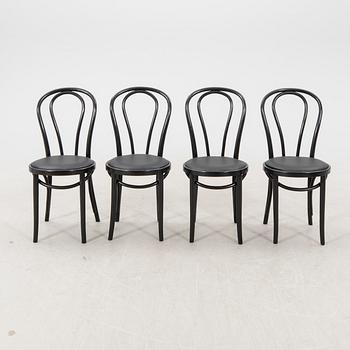A swt of four painted chairs later part of the 20th century.