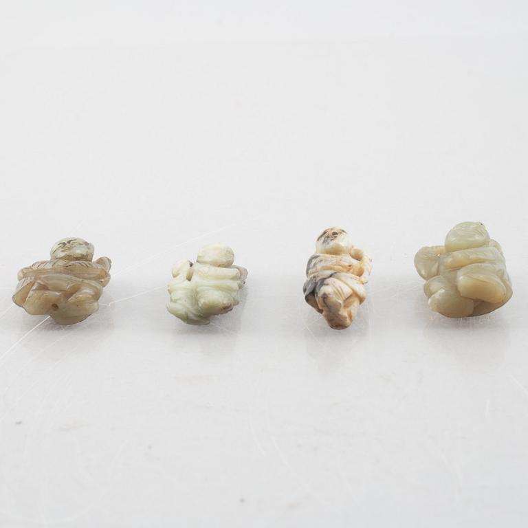 A group of four Chinese stone charms, 20th century.