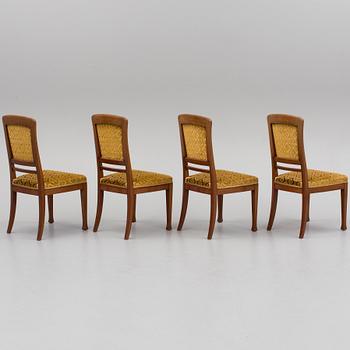 An early 20th century table with 4 chairs.