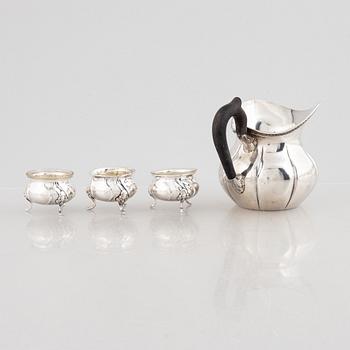 A Danish silver jug and three salt cellars, first half of the 10th Century.