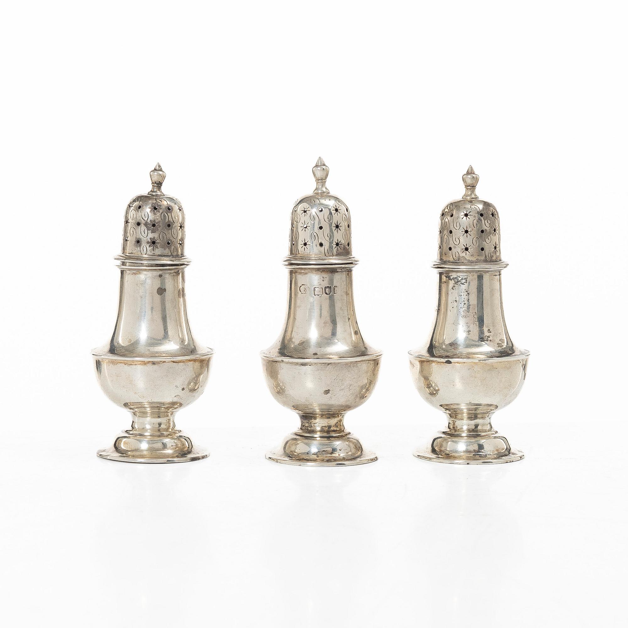 Three silver shakers by William Hutton & sons Ltd, London, England, 1903.