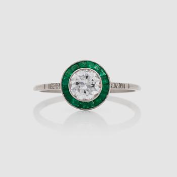 1247. A emerald and diamond, circa 0.62 ct, circa quality G-H/SI, ring.