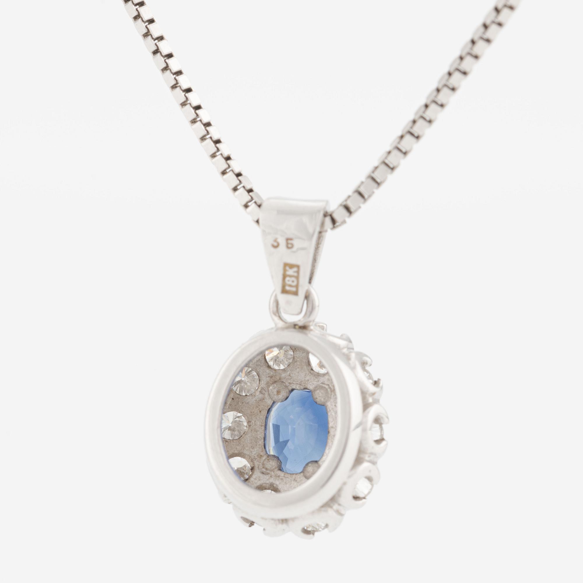 Hänge med kedja 18K guld med en safir och runda briljantslipade diamanter.