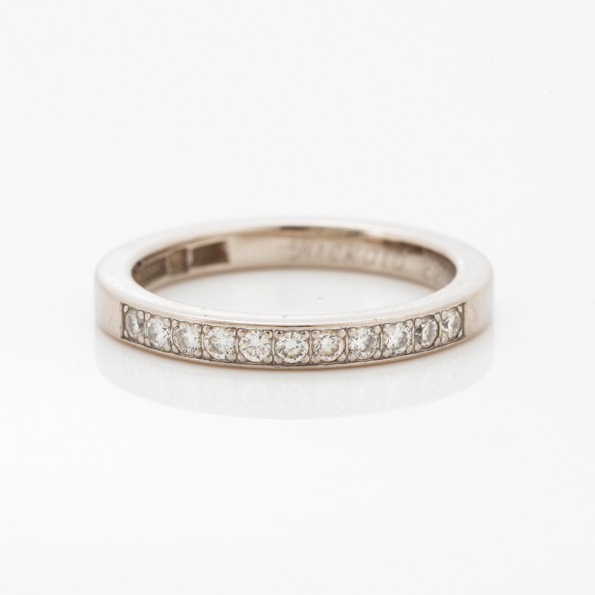 Brilliant-cut diamond half eternity ring.