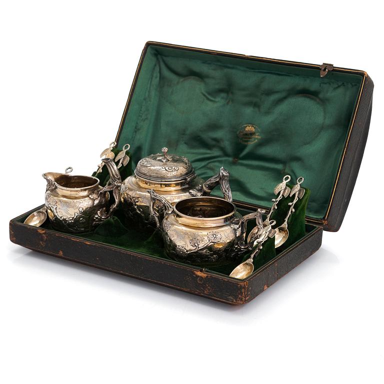 A 9-piece parcel-gilt sterling silver tea set, maker's mark of Samuel Smily, Goldsmiths Alliance Ltd, London 1873-74.