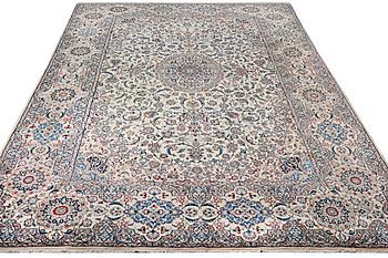 A Nain carpet, part islk, 9 laa, c. 453 x 298 cm.