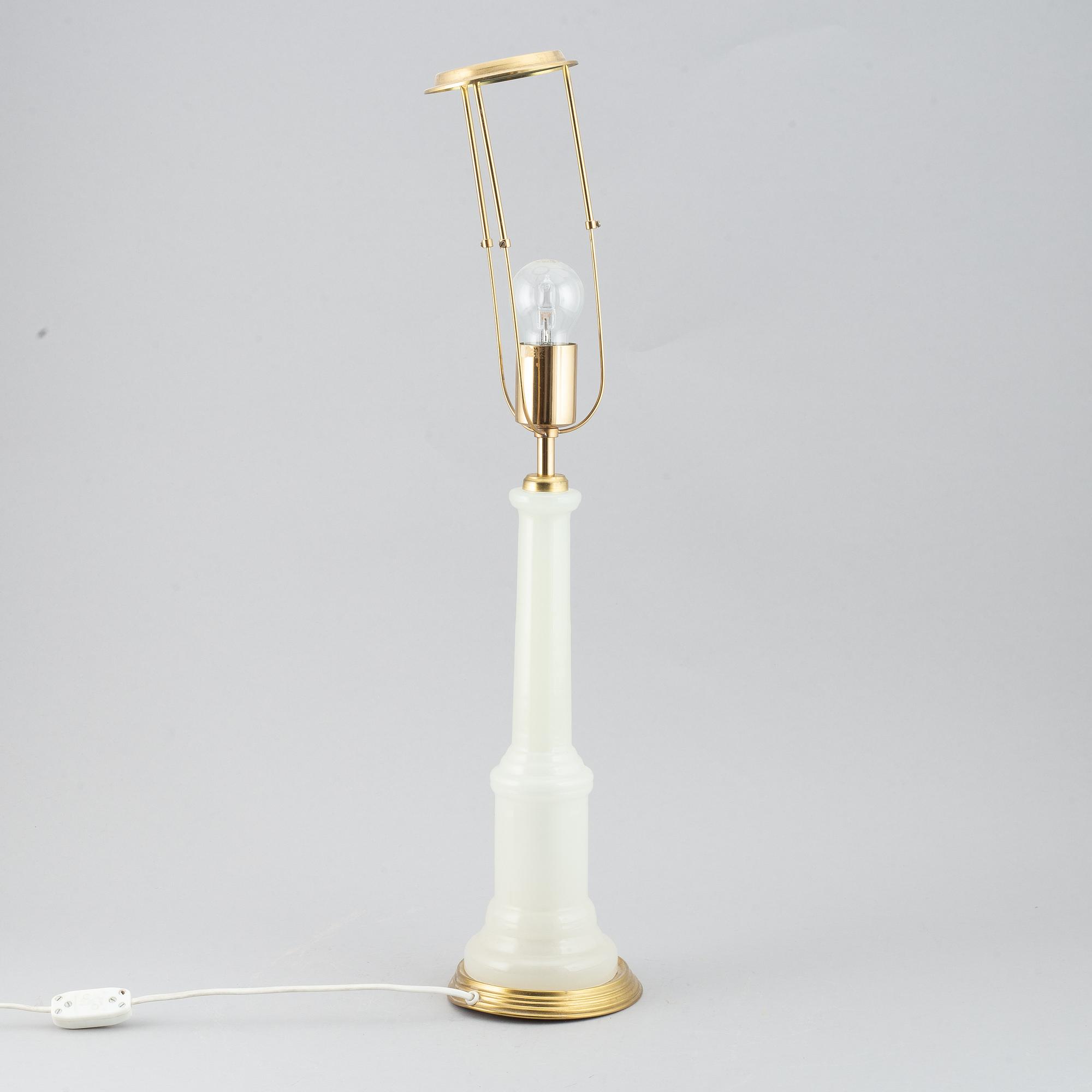 A brass and glass table lamp with lamp-shade. Svenskt Tenn, model no. 2583.