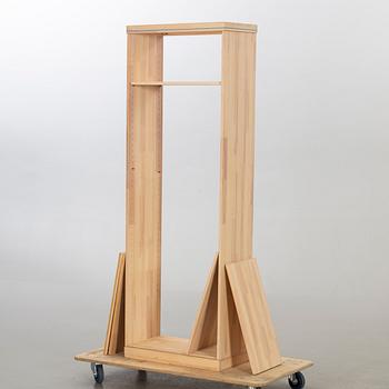 OLOF PIRA, A SIDEBOARD AND A BOOKCASE.