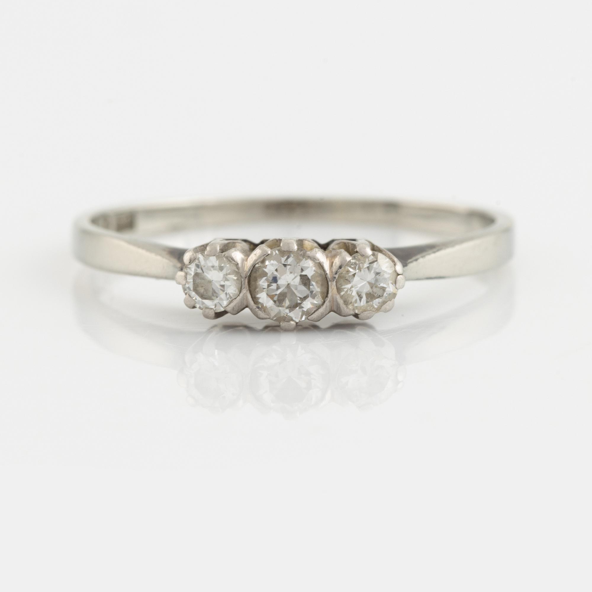 White gold and three brilliant cut diamond ring.