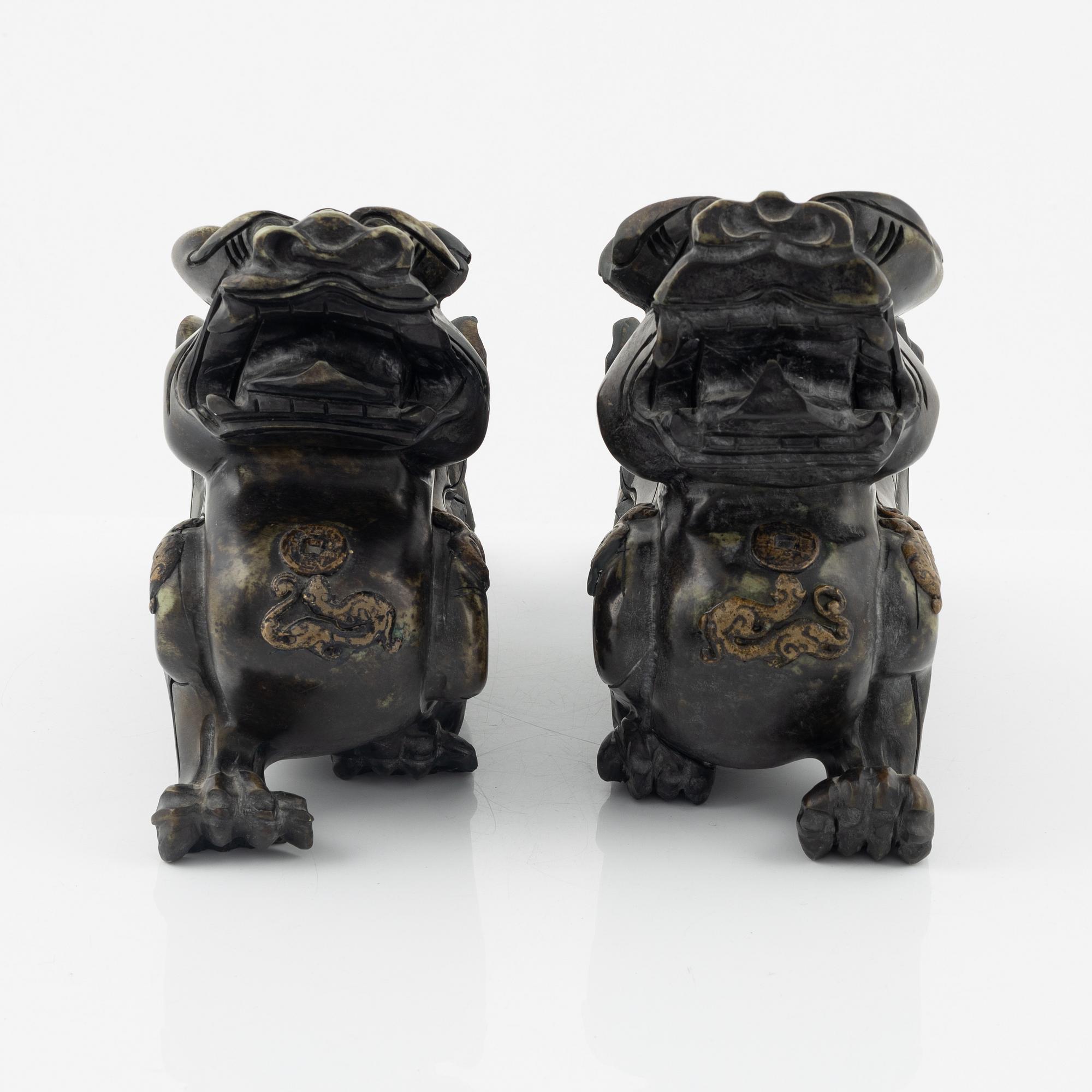 A pair of Chinese stone sculptures of mythical creatures, 20th Century.