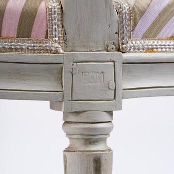 A pair of Gustavian open armchairs by E. Öhrmark (master in Stockholm 1777-1813).