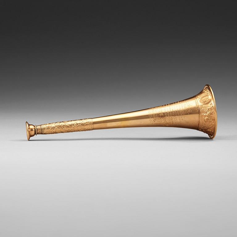 An English 19th century gold hunting-horn, marked Henry Potter & Co., London 1878.