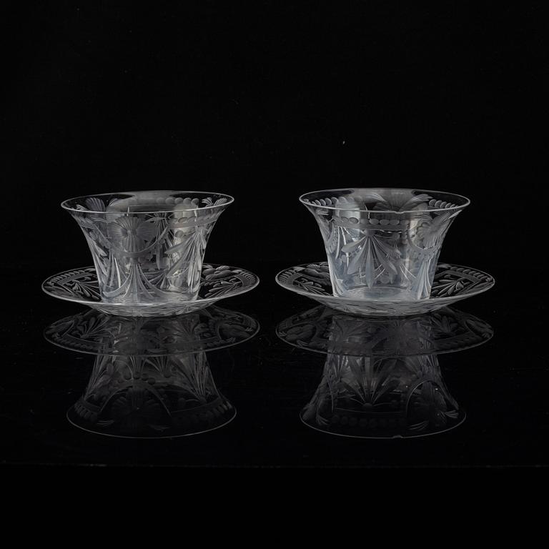 A pair of glass bowls with dishes, 20th century.