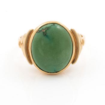 18K gold ring with green stone.