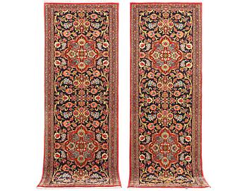 A pair of Quum rugs, c. 176 x 60 cm & c. 178 x 58 cm.