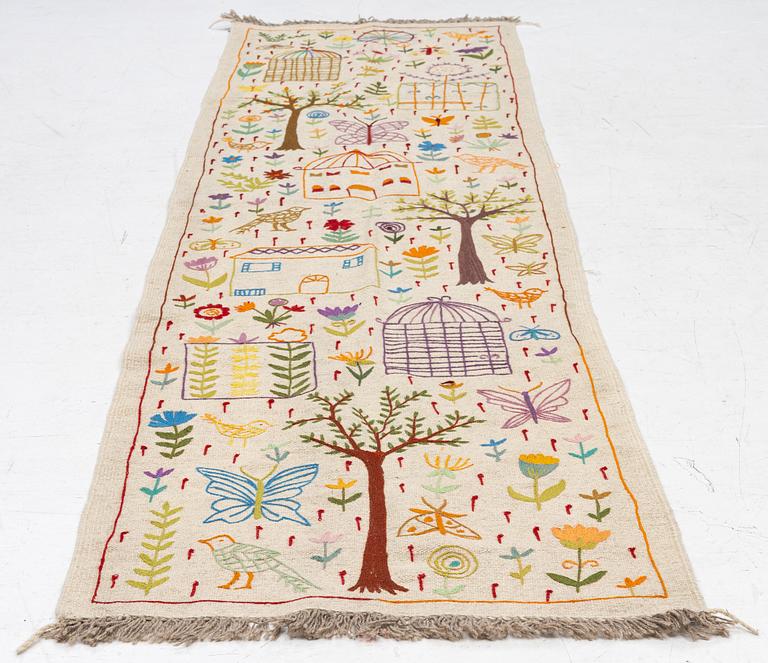 A hand-embroidered kilim runner, c. 300 x 80 cm.