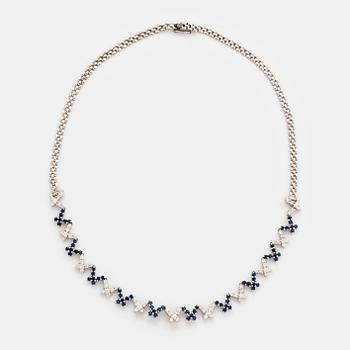 489. An 18K white gold necklace set with round brilliant-cut diamonds and sapphires.