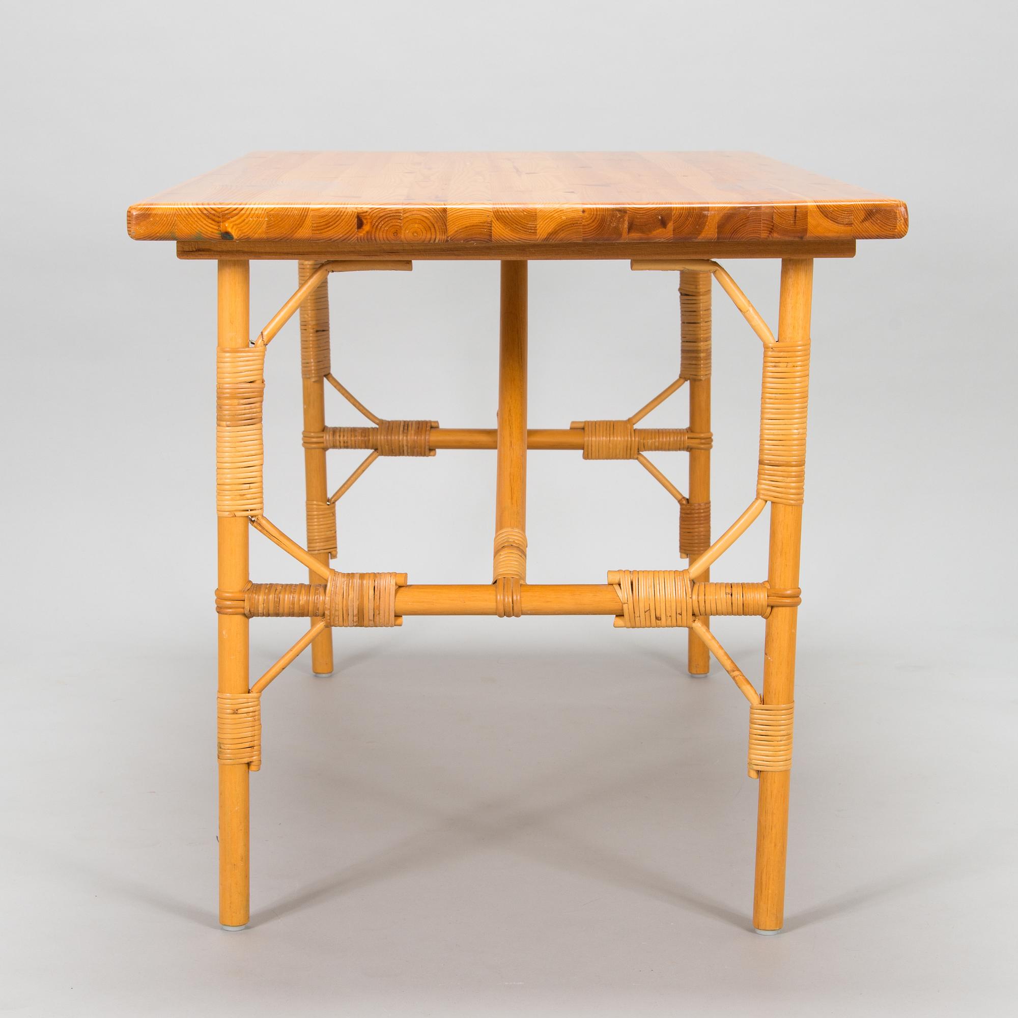 A pine wood and rattan table, late 20th century.