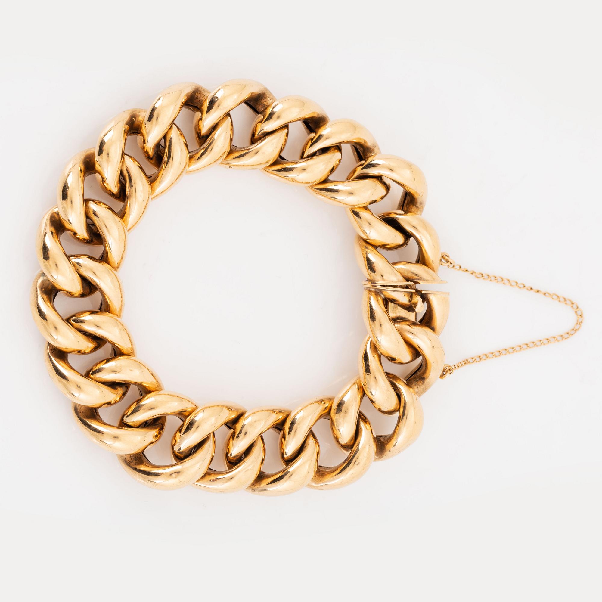 An 18K gold bracelet.