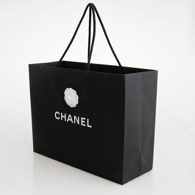CHANEL, A Large Black Leather Shopping Bag.
