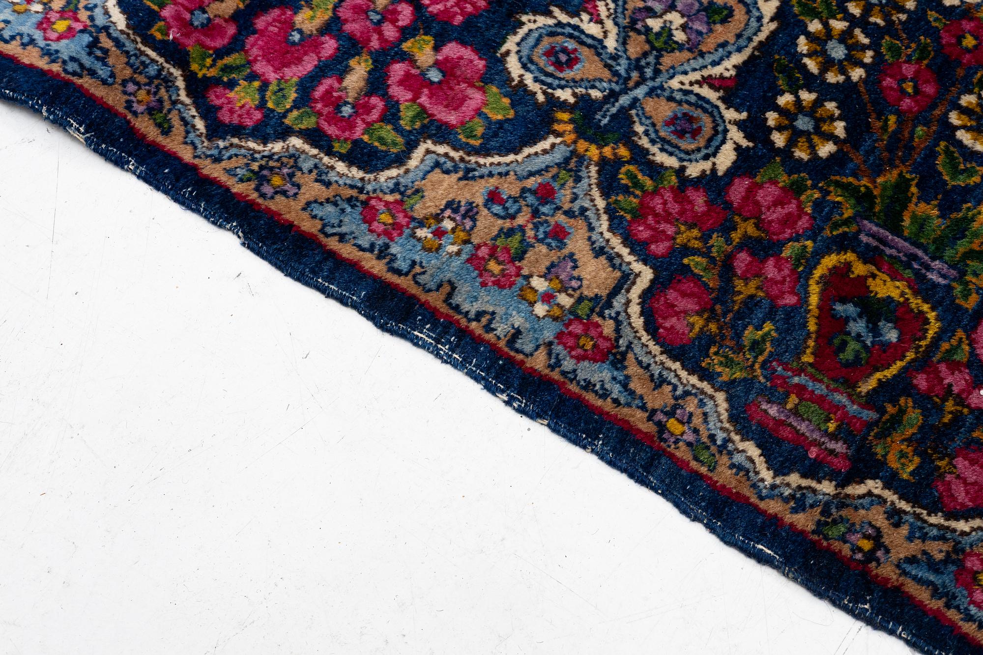 A semi-antique Kirman carpet, south Persia, c. 440 x 279 cm.
