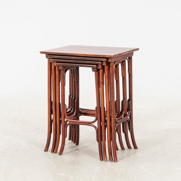 An early 19th century nest of four tables in stained beech from Thonet.