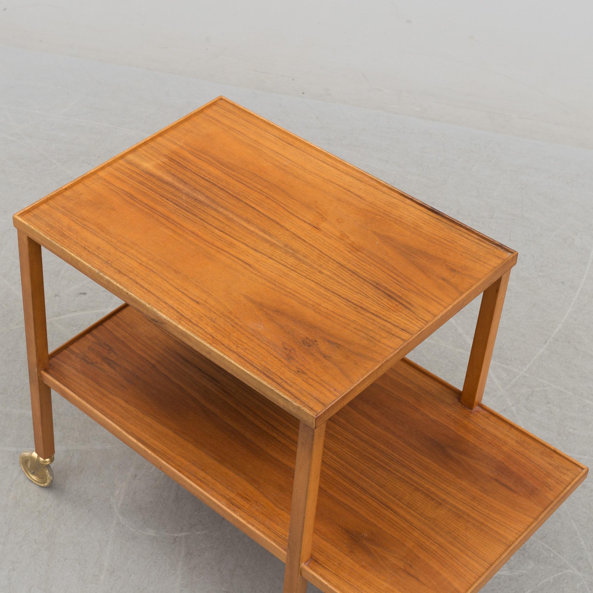 A walnut tea trolley model 470 by Josef Frank for Firma Svenskt Tenn.