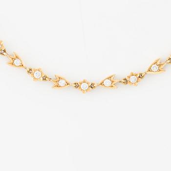 A necklace in 18K gold round brilliant-cut diamonds.