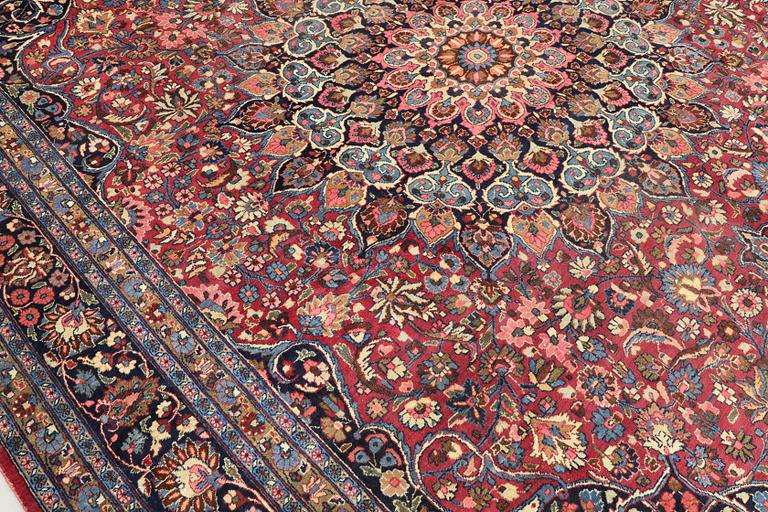 A semi-antique Meshed carpet, approx. 399 x 311 cm.