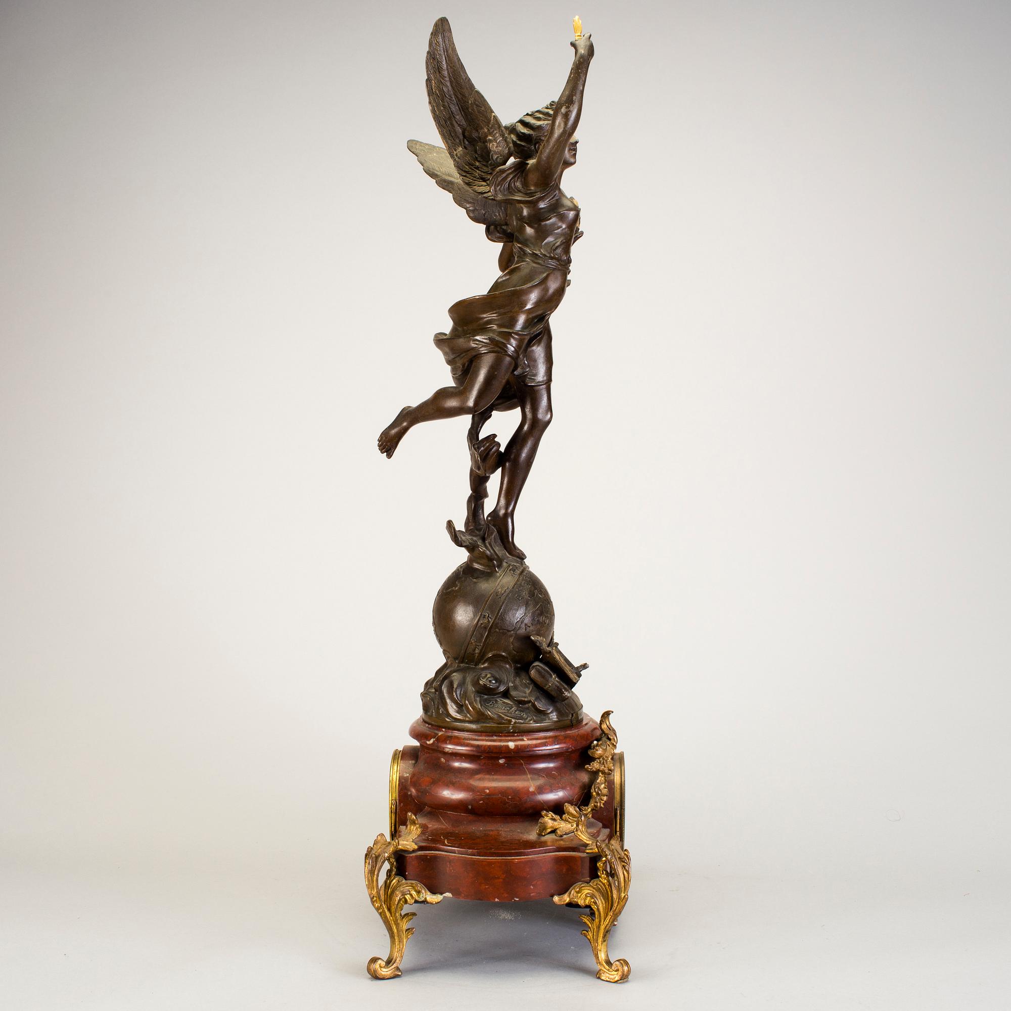 A mantel clock with sculpture "L'occident" after Émile Bruchon from the turn of the century 1800/1900.