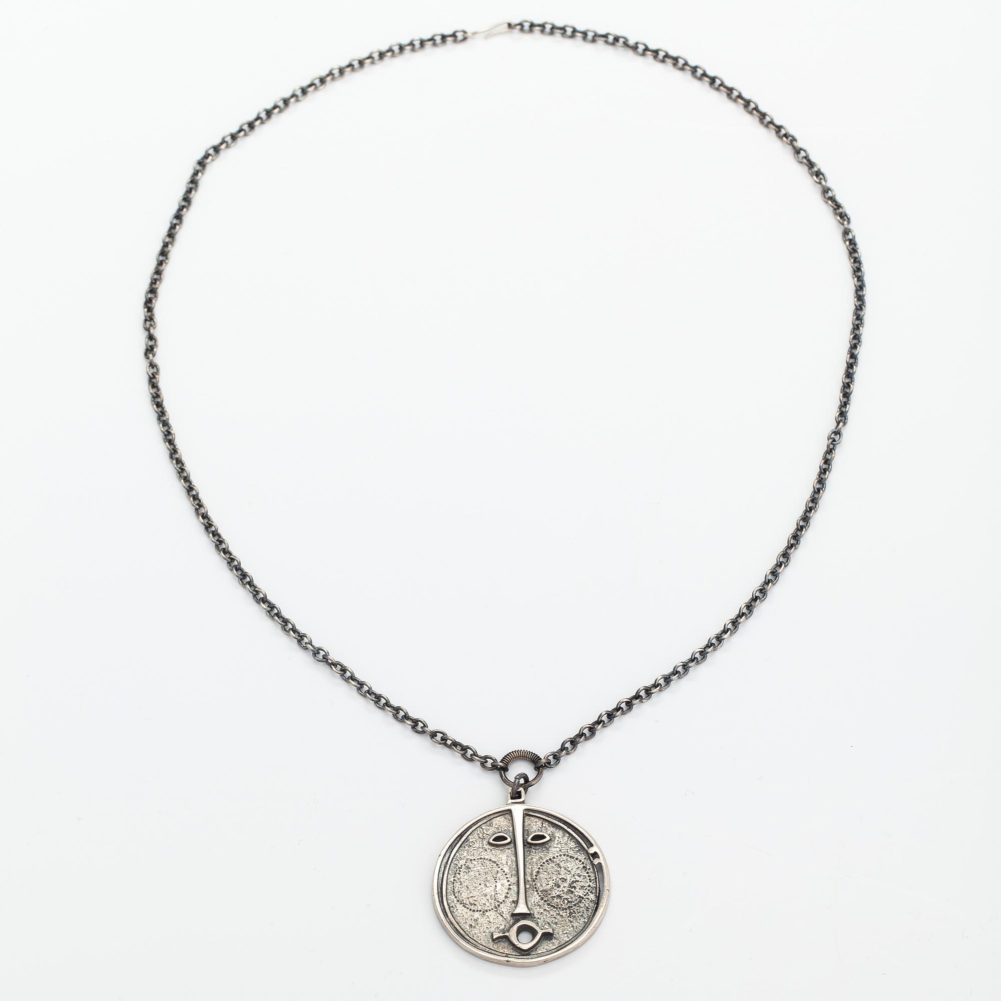 Jorma Laine, A sterling silver necklace "Face mask". Turun Hopea, Turku.