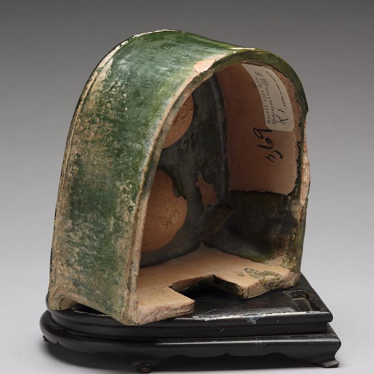 A green glazed pottery model of a stove, Han dynasty (206 BC-220 AD).