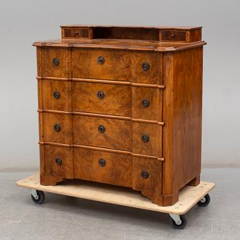 a walnur chest of drawers from the mid 1800's.