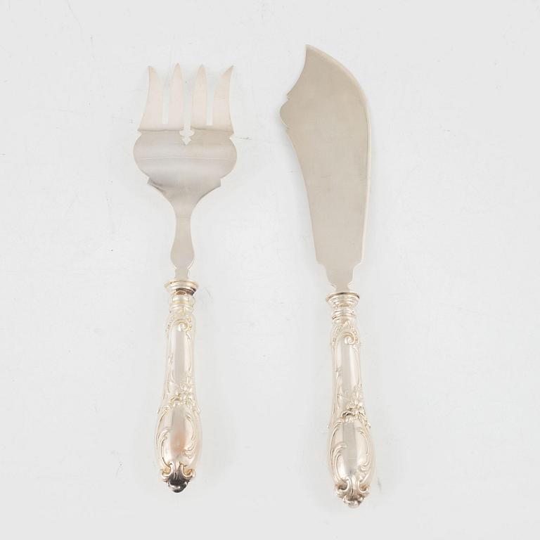 A silver carving knife and fork set, circa 1900.