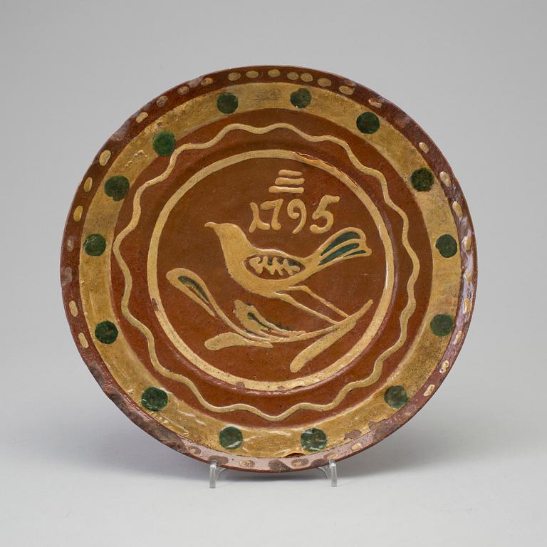 AN EARTHENWARE DISH, dated 1795.