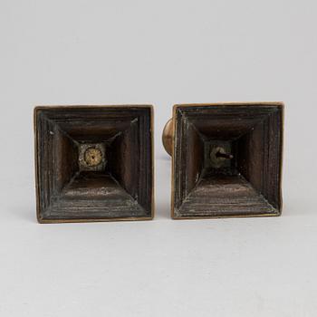 A PAIR OF BRONZE CANDLESTICKS, first half of the 19th century.