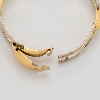 An 18K gold and white gold Cartier bracelet.