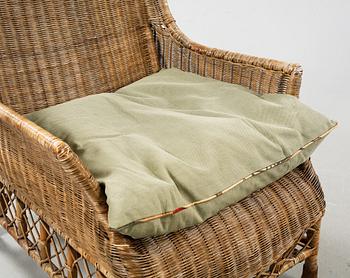 A rattan arm chair from the second half of the 20th century.