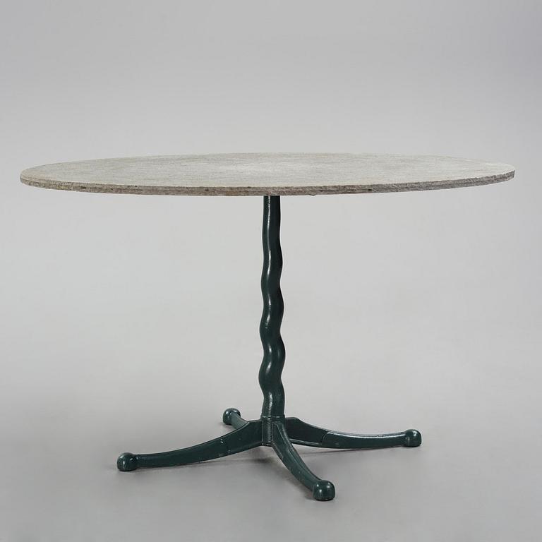 Josef Frank, attributed to, a cast iron table with granite top, Firma Svenskt Tenn, Sweden, 1930s-40s.