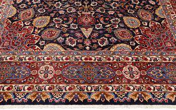 A Kashmar carpet from eastern Iran of 'Ardabil' design, signed, c 338 x 245 cm.