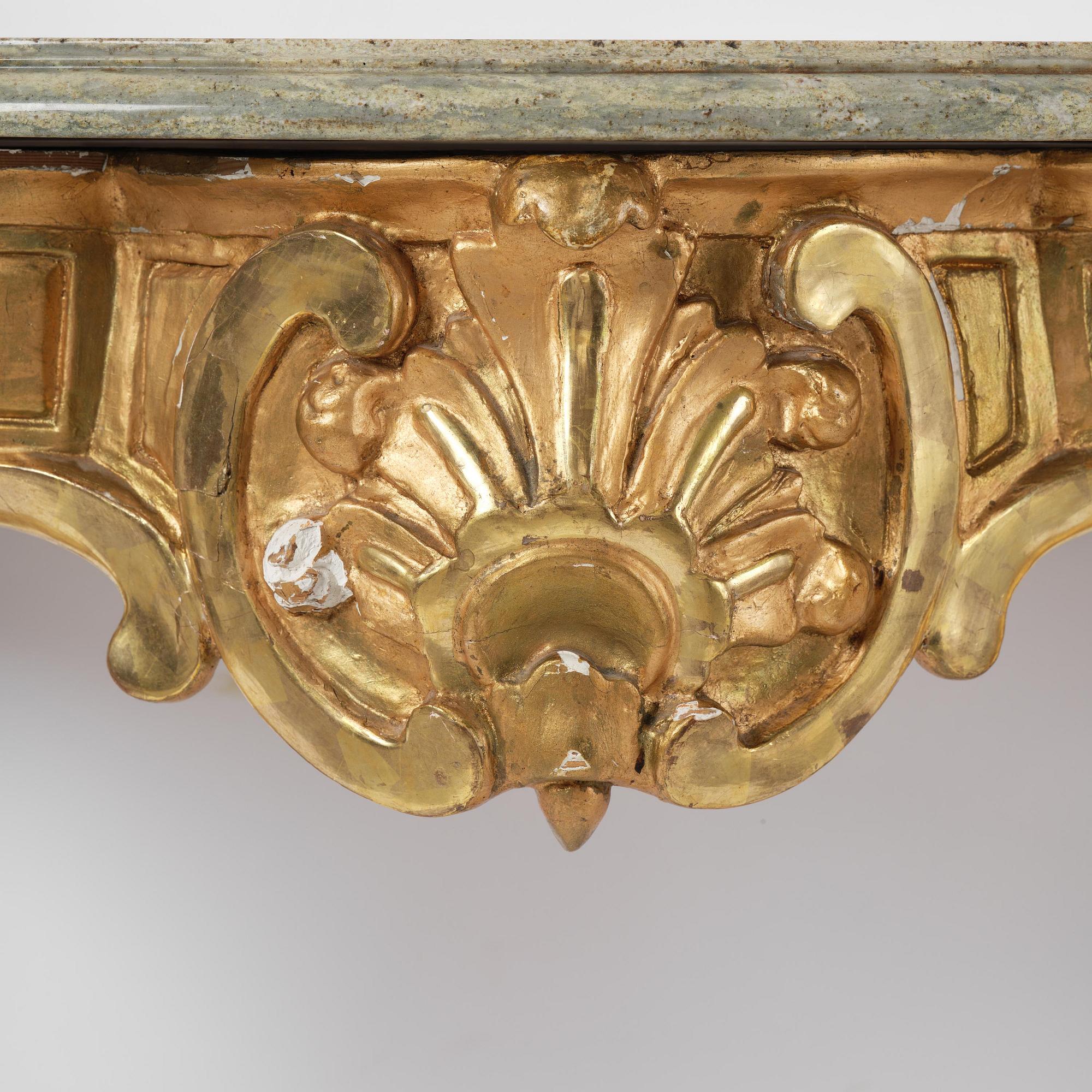 A rococo gilt-gesso and marble-top console table, Stockholm, later part 18th century.