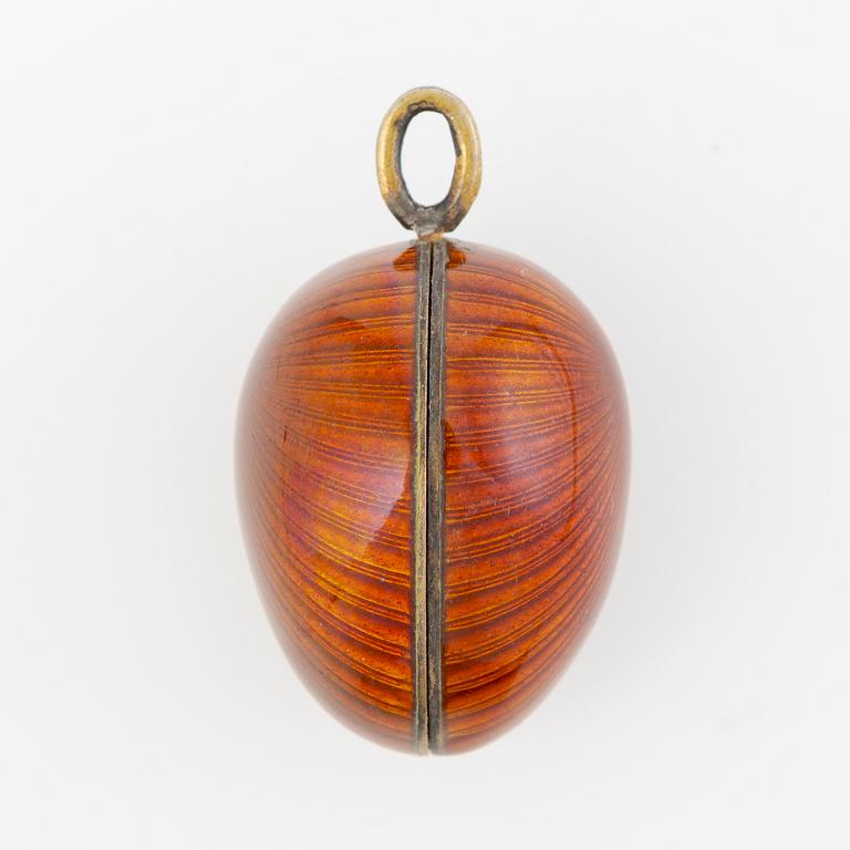 Pendant, in the form of an egg, A. Tillander, gilded silver and red enamel, Finland 1977.
