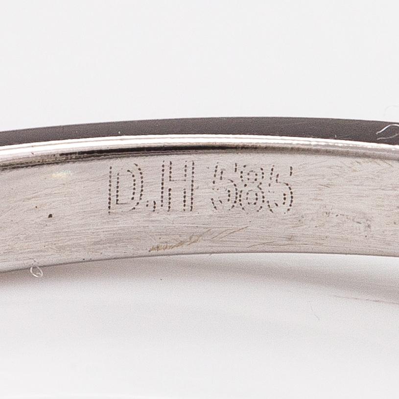 A 14K white gold ring with diamonds ca. 1.50 ct in total and rubies ca. 0.39 ct in total. GWlab-certificate.