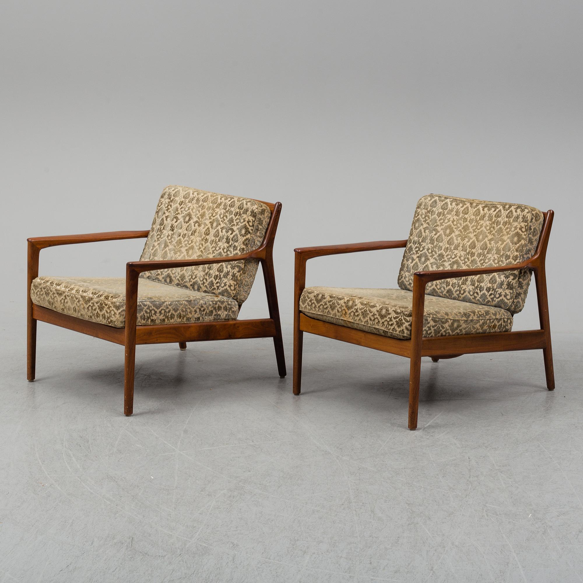 A pair of 'USA 75' teak easy chairs by Folke Ohlsson for Dux.