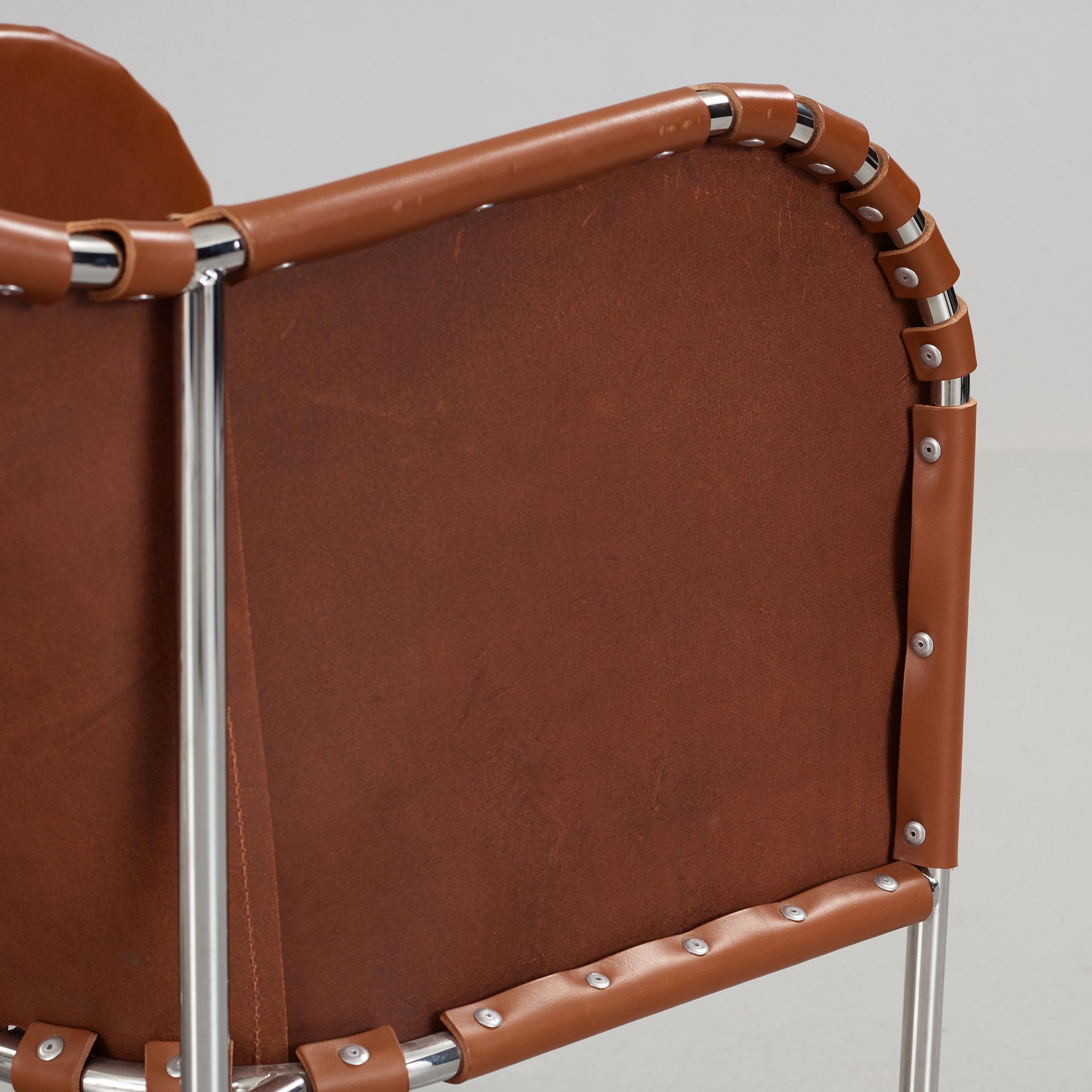 Mats Theselius, A pair of 'Bruno' brown leather and steel easy chairs, Källemo, Sweden.