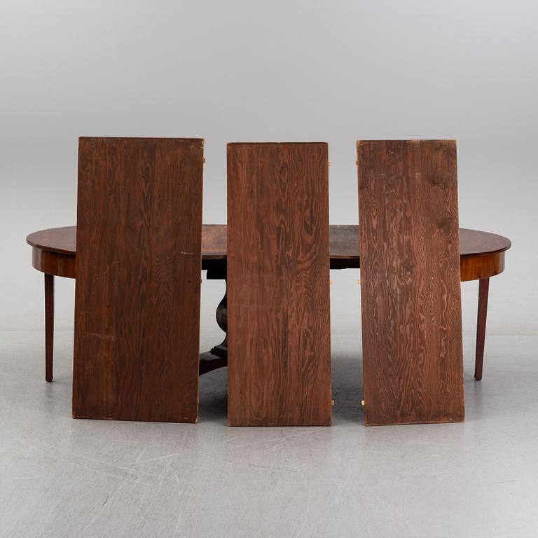 A mahogany veneered dining table, mid 19th Century.