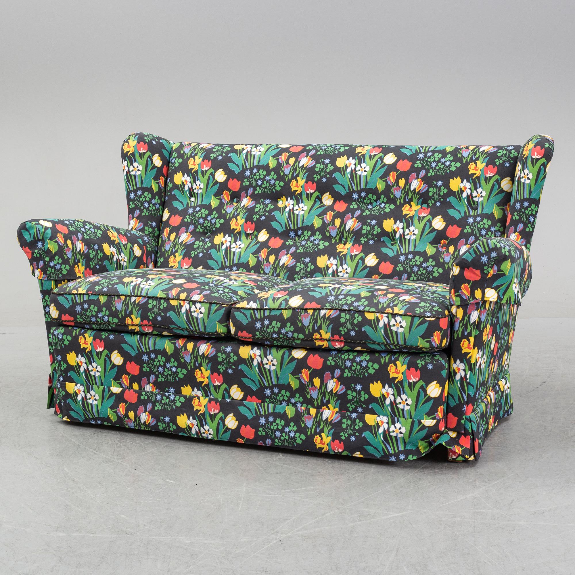 A sofa and wingback chair, later part of the 20th Century.
