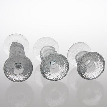 TIMO SARPANEVA, SEVEN FESTIVO GLASS CANDLESTICKS, Iittala, partly signed TS.