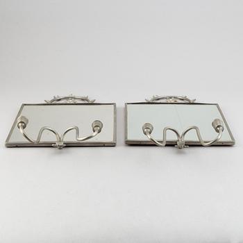 Two pewter wall sconces from Firma Svenskt Tenn, 1925.