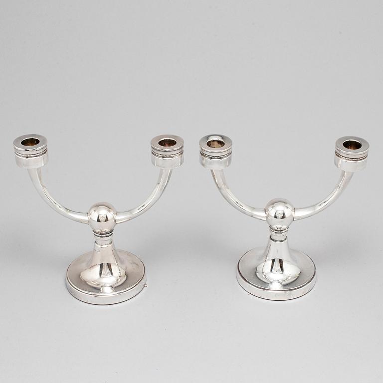 A pair of silver candelabra from MGAB, Uppsala, 1969-71.